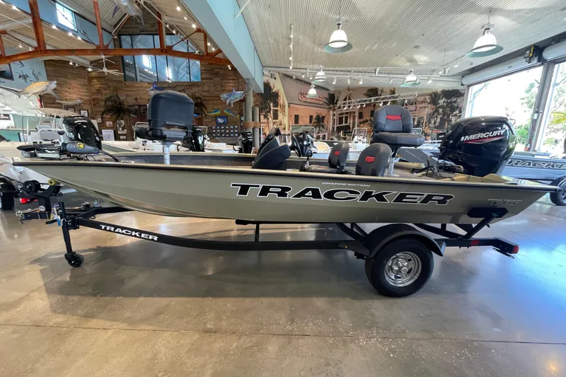The Image of 2026 Tracker Pro Team 175 Crappie Edition boat displayed in a showroom. - 0