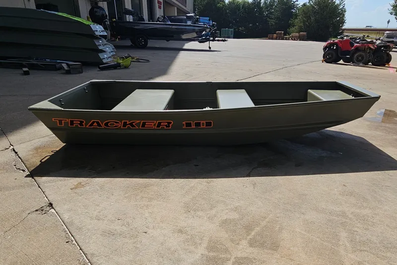 Slide: The Image of 2026 Tracker Grizzly 12 Jon boat on concrete surface, outdoor setting. - 42