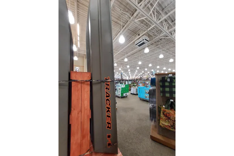 Slide: The Image of 2026 Tracker Grizzly 12 Jon boat displayed in a well-lit store interior. - 41
