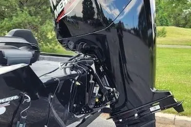 Slide: The Image of 2026 Tracker Pro Team 175 boat with Mercury outboard motor, parked on a sunny day. - 4