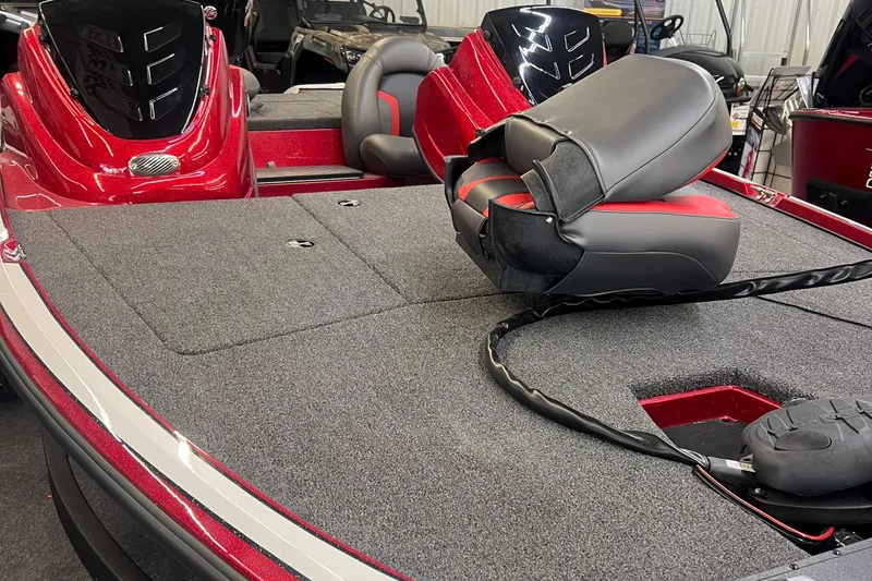 Slide: The Image of Red Nitro Z17 2026 boat interior with cushioned seating and carpeted deck. - 1