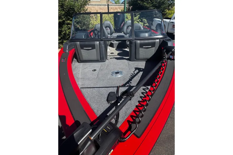 Slide: The Image of 2026 Tracker Targa V-18 Combo boat interior with seating and equipment, featuring a red exterior. - 6