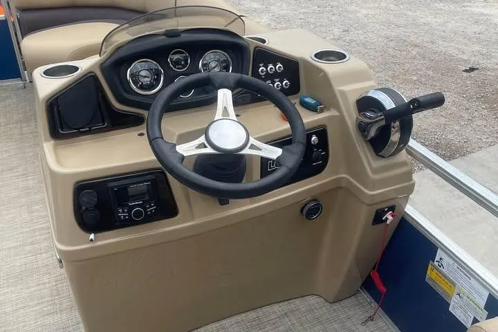 Slide: The Image of Steering console of 2018 Lowe SS230 Walk-Thru pontoon boat with gauges and controls. - 11