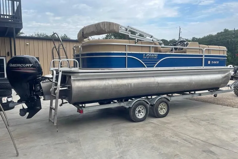 Slide: The Image of 2018 Lowe SS230 Walk-Thru pontoon boat on trailer with Mercury outboard motor. - 3