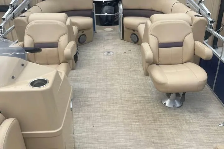 Slide: The Image of 2018 Lowe SS230 Walk-Thru boat interior with beige seating and spacious layout. - 5