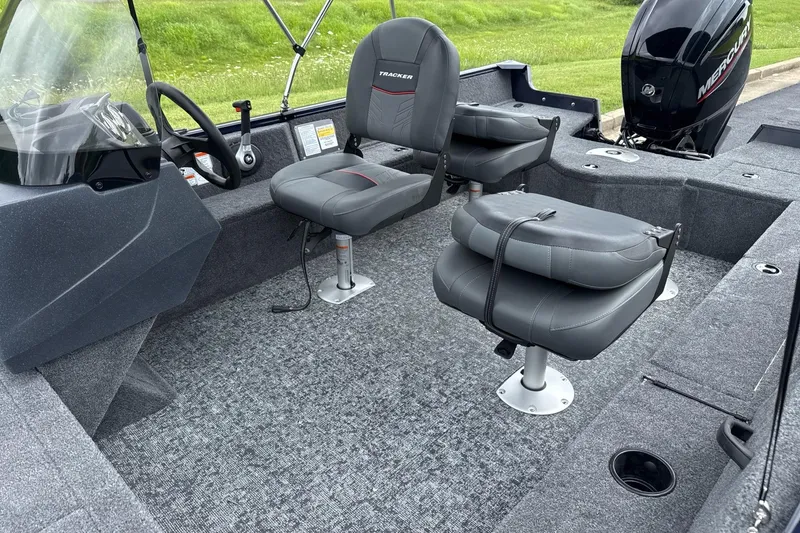 Slide: The Image of 2026 Tracker Pro Guide V-16 SC boat interior with seating and controls. - 6