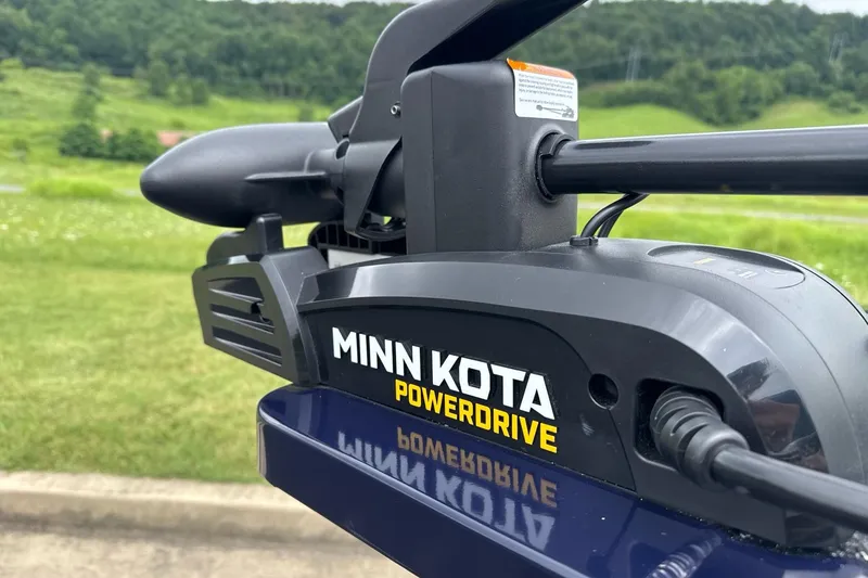 Slide: The Image of Minn Kota PowerDrive motor on 2026 Tracker Pro Guide V-16 SC boat, scenic background. - 8