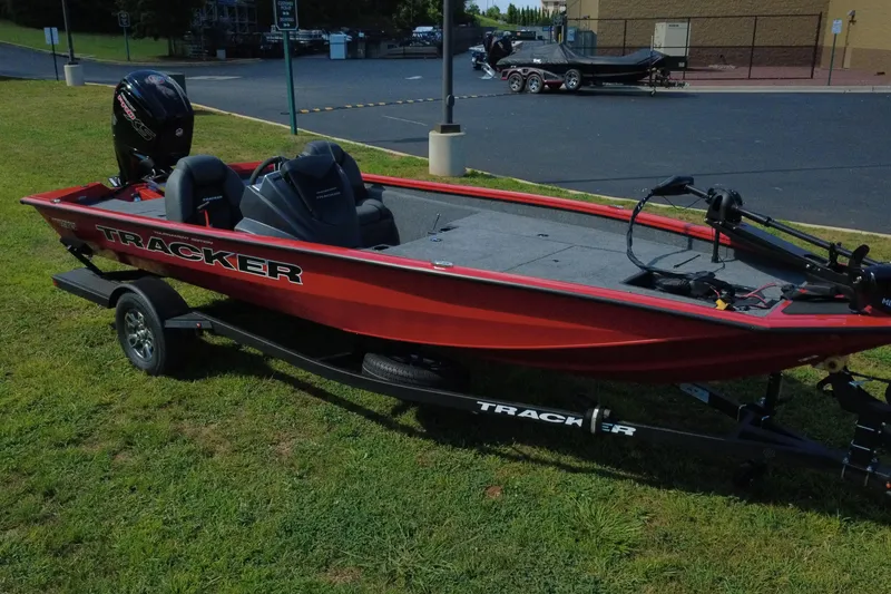 Slide: The Image of 2026 Tracker Pro Team 190 boat on trailer, parked on grass. - 4