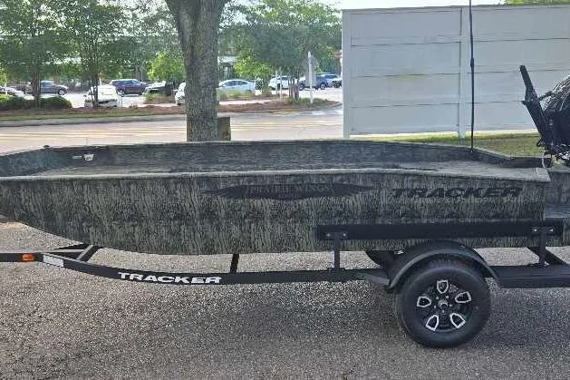 Slide: The Image of 2026 Tracker Grizzly 1650 T Prairie Wings Edition boat with camouflage design on display. - 2