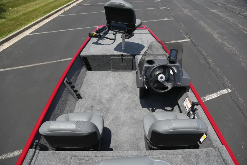 Slide: The Image of 2026 Tracker Bass Tracker Classic XL boat interior with steering console and seating. - 4