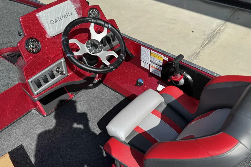 Slide: The Image of Red and gray interior of 2026 Nitro Z18 Pro boat with Garmin dashboard. - 8
