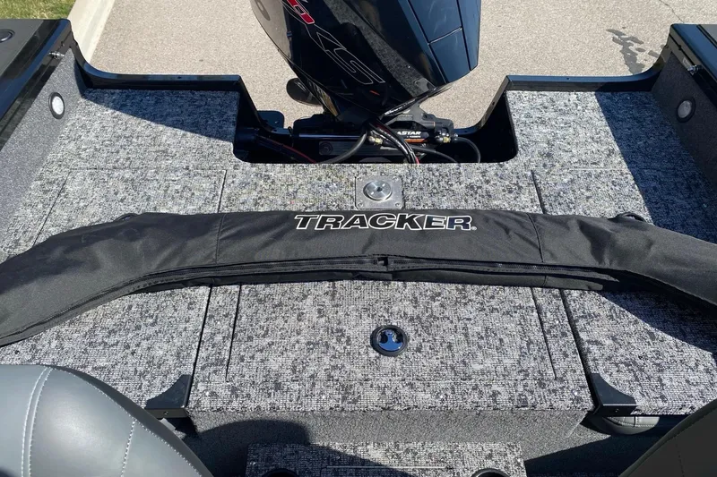 Slide: The Image of 2026 Tracker Targa V-18 Combo boat deck with motor and branded cover. - 8