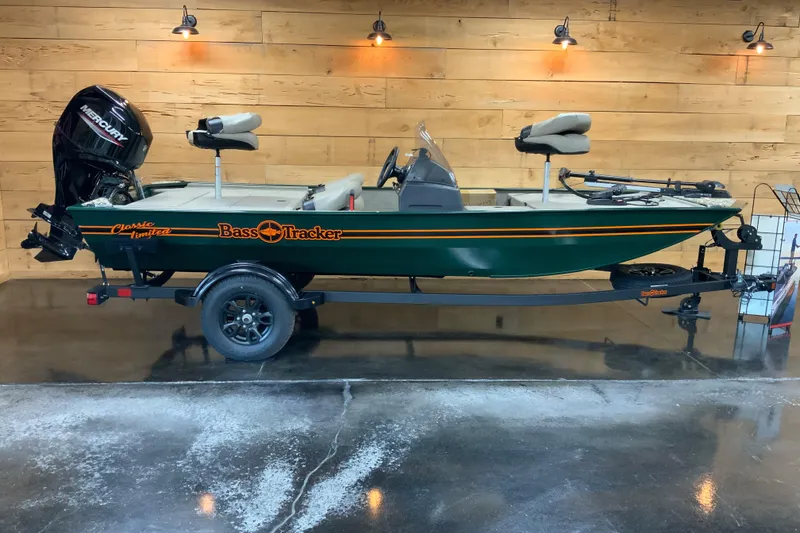 The Image of 2026 Tracker Bass Tracker Classic Limited fishing boat in showroom, side view. - 0