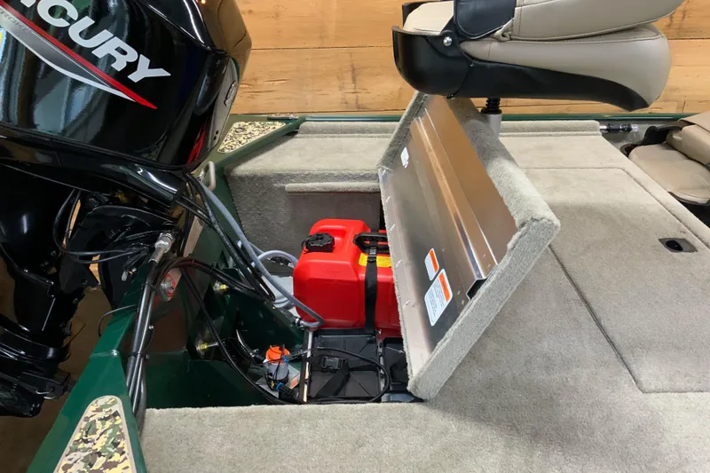 Slide: The Image of 2026 Tracker Bass Tracker Classic Limited boat interior with Mercury engine and storage compartment. - 10