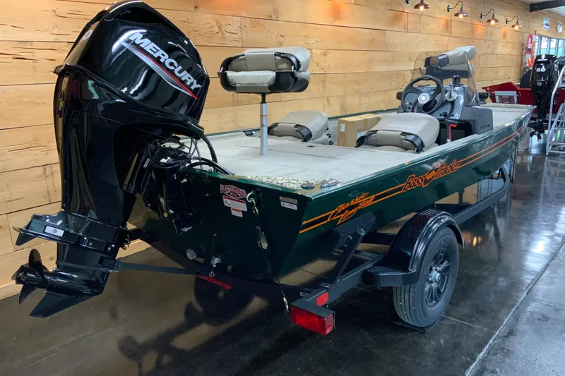 Slide: The Image of 2026 Tracker Bass Tracker Classic Limited boat with Mercury engine in showroom. - 2