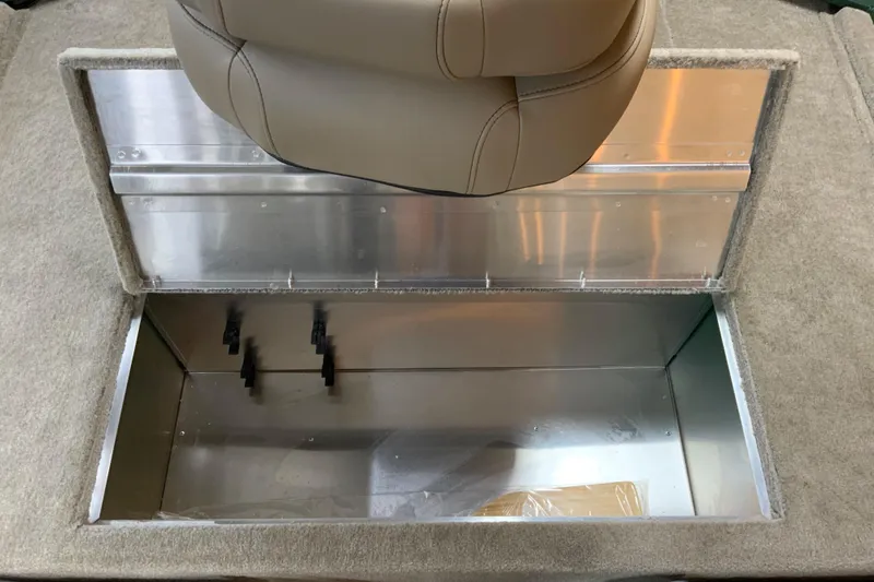 Slide: The Image of 2026 Tracker Bass Tracker Classic Limited boat storage compartment with beige seat above. - 8