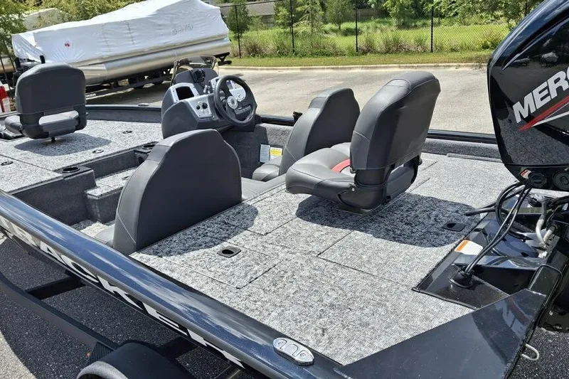 Slide: The Image of 2026 Tracker Pro Team 175 boat interior with seating and steering wheel. - 62