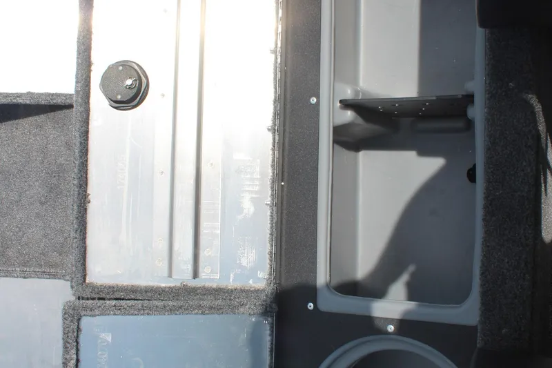 Slide: The Image of 2026 Tracker Pro Guide V-16 WT boat interior storage compartments and flooring detail. - 15