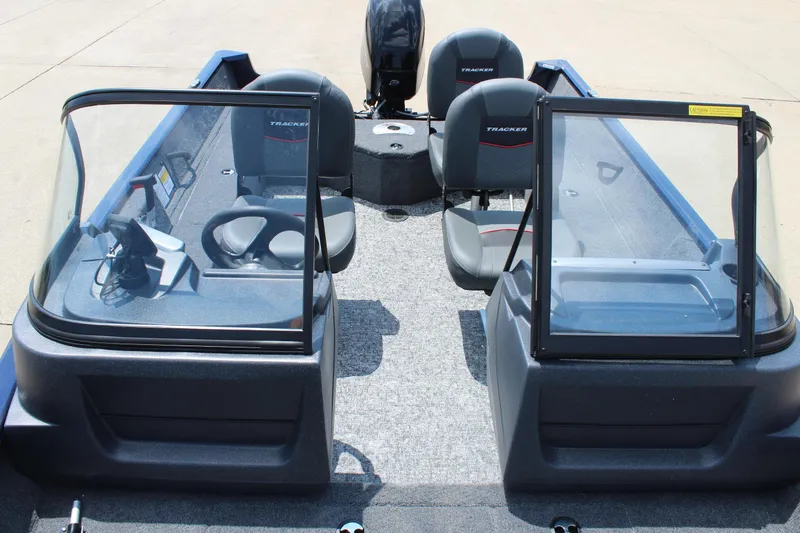 Slide: The Image of 2026 Tracker Pro Guide V-16 WT boat interior with dual consoles and seating. - 18