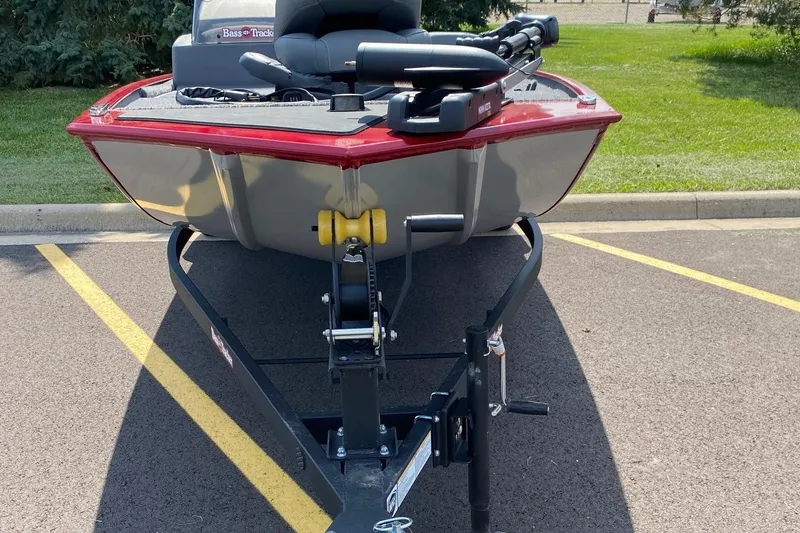 Slide: The Image of 2026 Tracker Bass Tracker Classic XL boat on trailer in parking lot. - 2