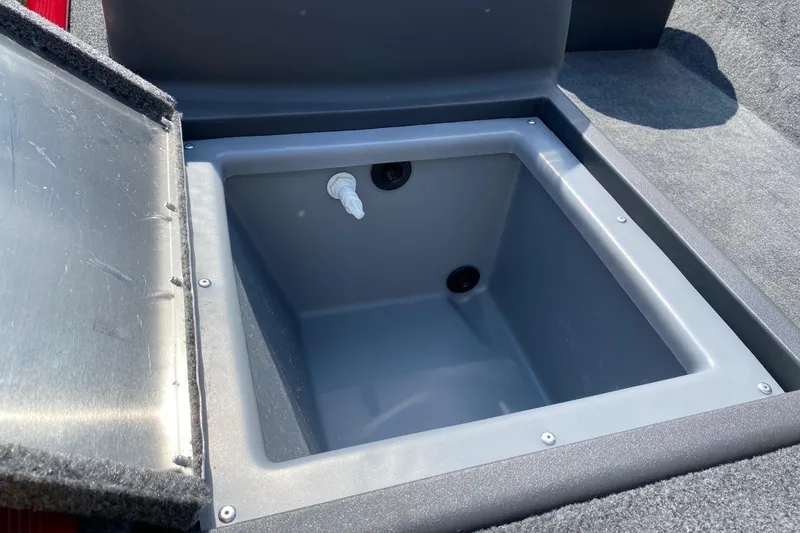 Slide: The Image of Open storage compartment in 2026 Tracker Bass Tracker Classic XL boat. - 4