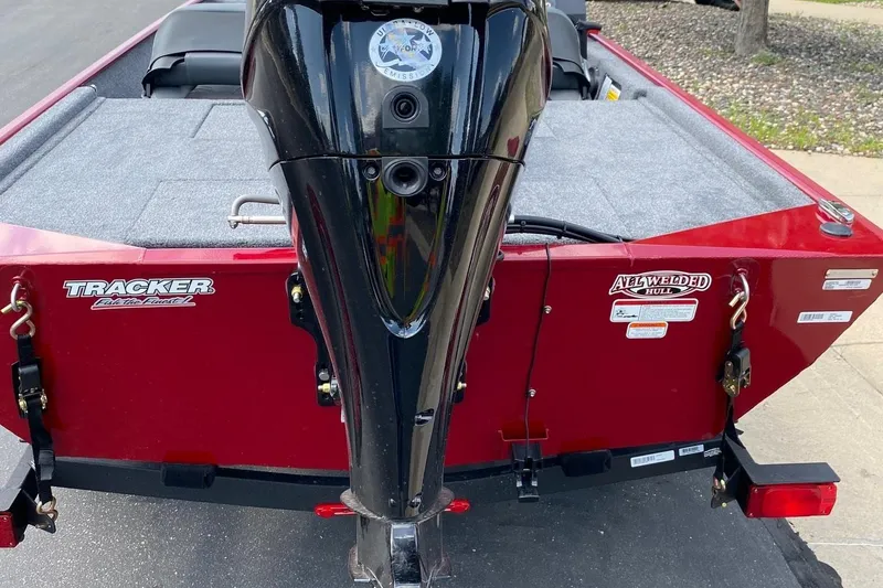 Slide: The Image of 2026 Tracker Bass Tracker Classic XL boat, red exterior, all-welded hull, rear view. - 9