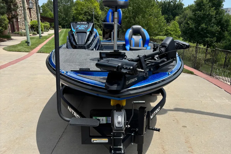 Slide: The Image of 2026 Nitro Z20 XL Pro fishing boat with Garmin equipment, parked outdoors. - 2