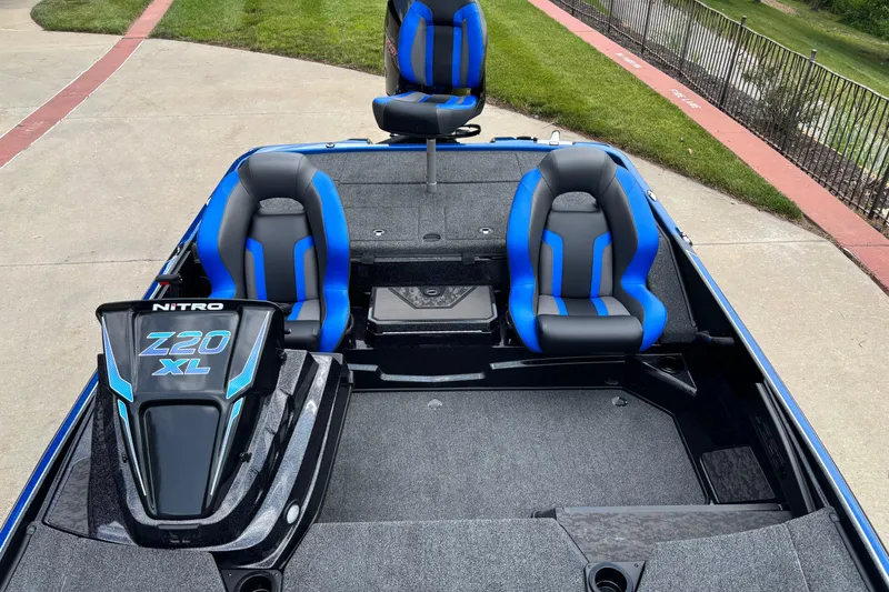 Slide: The Image of 2026 Nitro Z20 XL Pro boat interior with blue and black seats, showcasing modern design. - 4