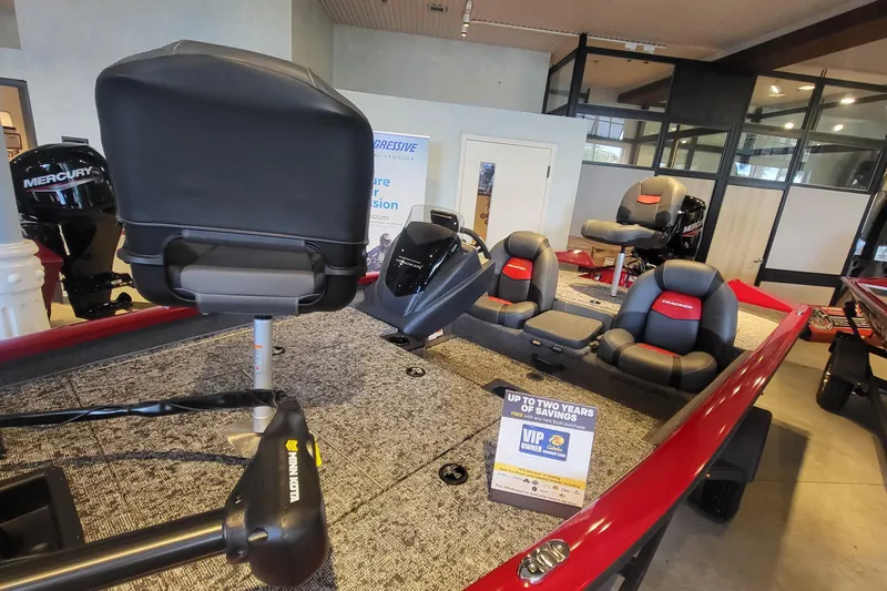 Slide: The Image of 2026 Tracker Pro Team 175 boat interior with seating and Mercury engine display. - 3