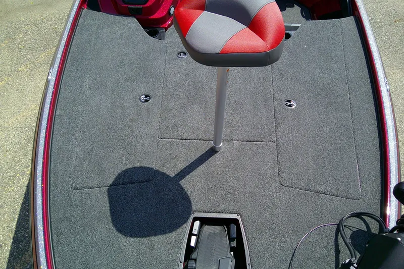 Slide: The Image of 2026 Nitro Z18 Pro boat deck with red and gray seat, carpeted surface. - 10