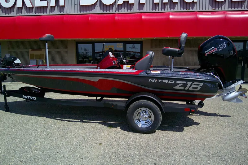 Slide: The Image of 2026 Nitro Z18 Pro boat displayed outside a dealership, featuring sleek design and powerful engine. - 2