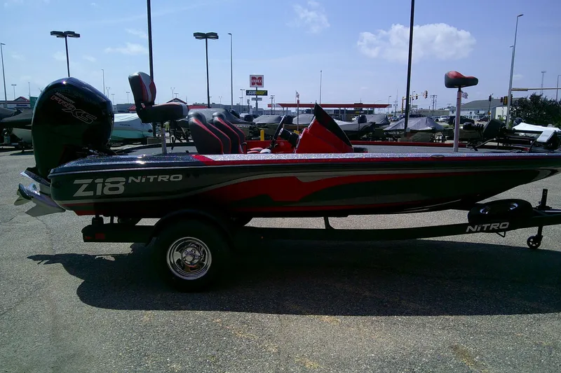 Slide: The Image of 2026 Nitro Z18 Pro boat in a parking lot, featuring sleek design and powerful engine. - 4