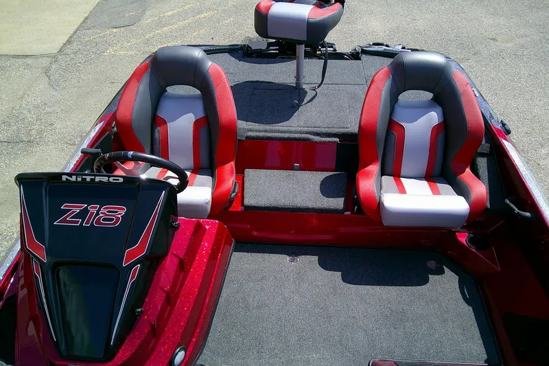 Slide: The Image of 2026 Nitro Z18 Pro boat interior with red and gray seats, steering console. - 8