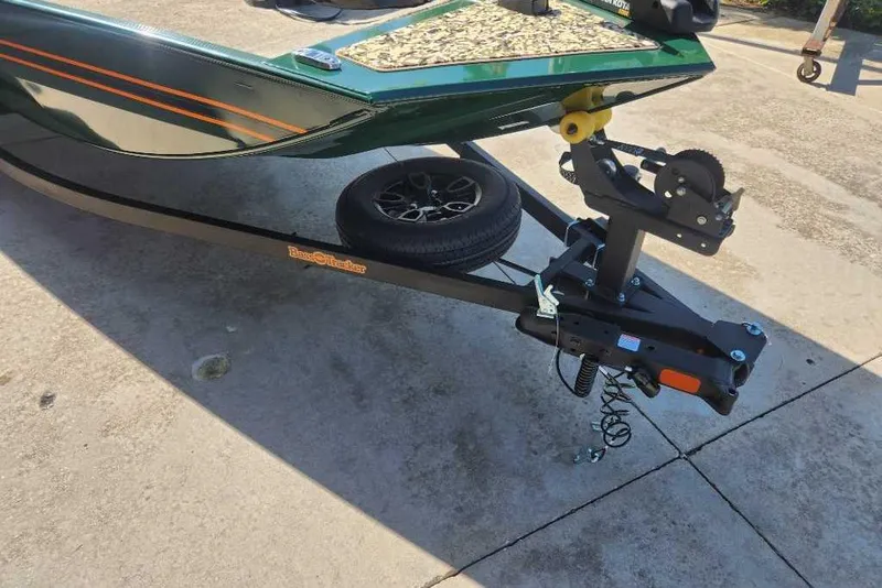 Slide: The Image of 2026 Tracker Bass Tracker Classic Limited boat trailer on concrete surface. - 52