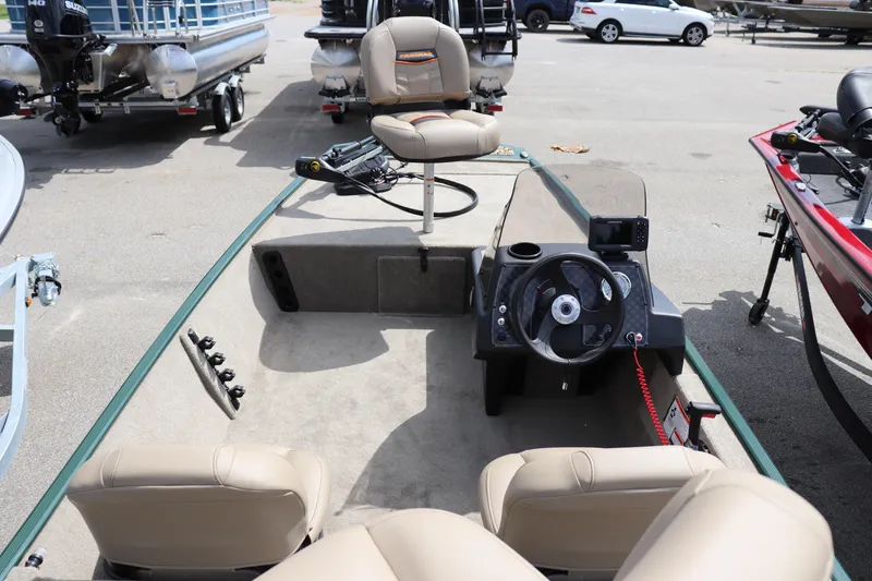 Slide: The Image of 2026 Tracker Bass Tracker Classic Limited boat interior with steering wheel and seating. - 11