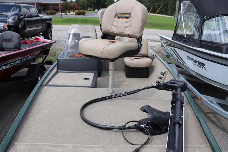 Slide: The Image of 2026 Tracker Bass Tracker Classic Limited boat with beige seating and trolling motor. - 2