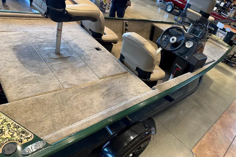 Slide: The Image of 2026 Tracker Bass Tracker Classic Limited boat interior with seating and steering console. - 3