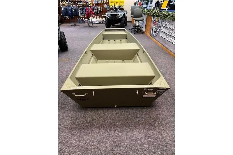 Slide: The Image of 2026 Tracker Grizzly 12 Jon boat displayed in a showroom setting. - 4
