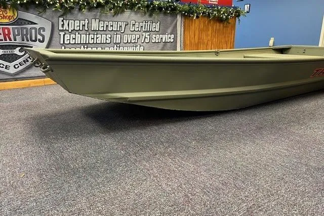 Slide: The Image of 2026 Tracker Grizzly 12 Jon boat displayed indoors, with promotional banner in background. - 3