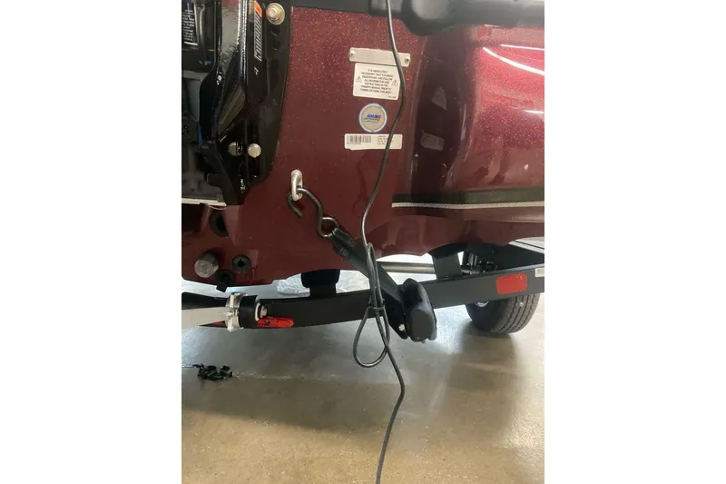 Slide: The Image of Rear view of a 2026 Nitro Z18 Pro boat trailer with hitch and wiring. - 100