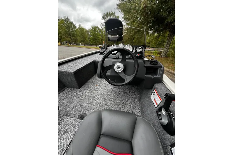 Slide: The Image of 2026 Tracker Pro 170 boat interior with steering wheel and dashboard controls. - 5