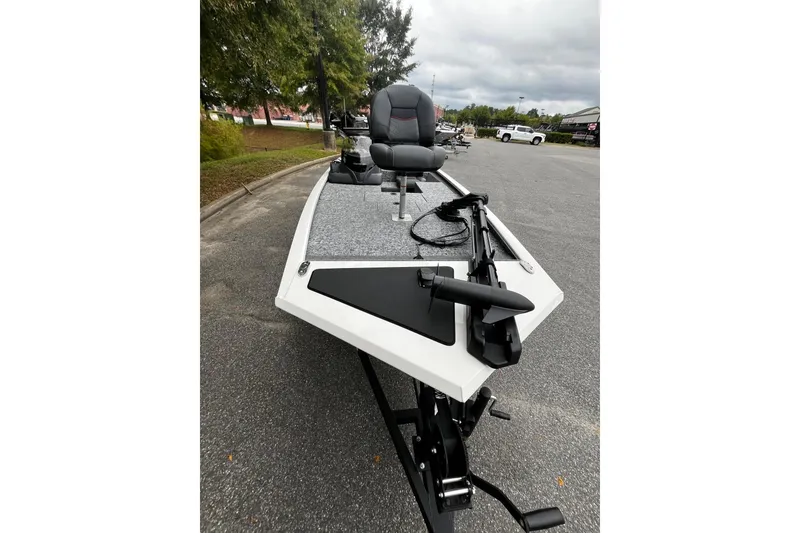 Slide: The Image of 2026 Tracker Pro 170 boat parked on pavement, featuring a sleek design and modern equipment. - 6