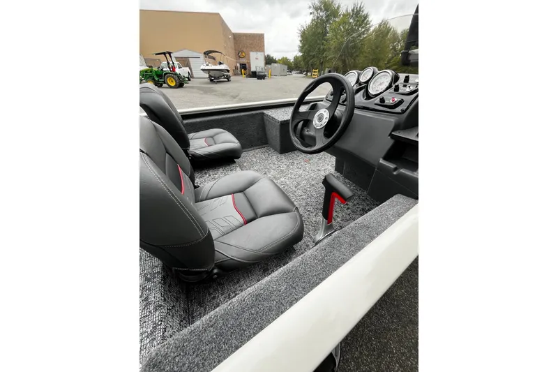 Slide: The Image of Interior of 2026 Tracker Pro 170 boat with steering wheel and seats. - 7