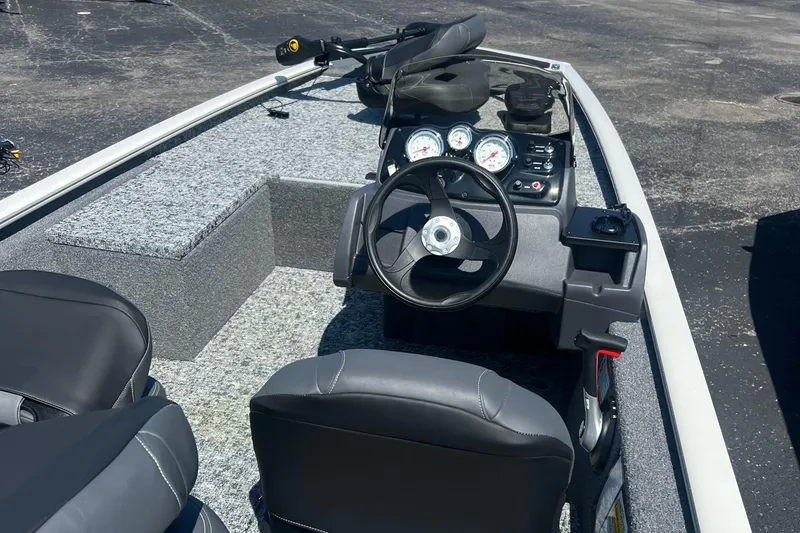 Slide: The Image of 2026 Tracker Pro 170 boat interior with steering wheel and dashboard controls. - 4