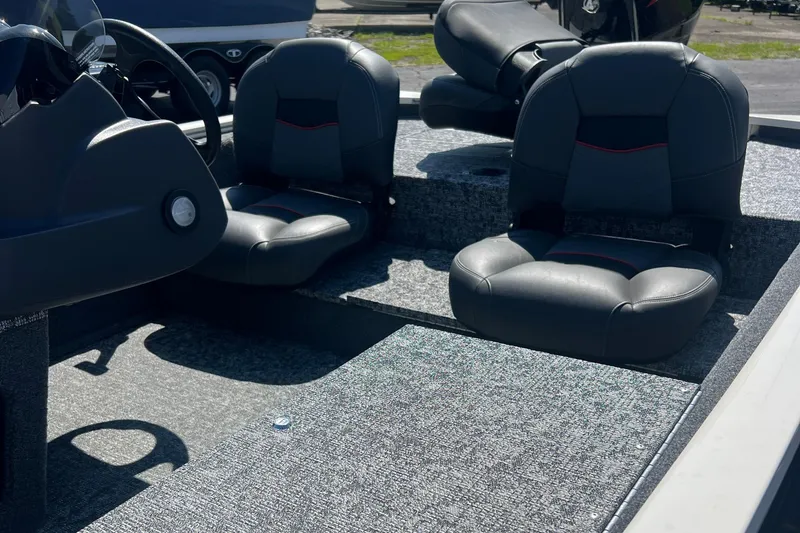 Slide: The Image of 2026 Tracker Pro 170 boat interior with two cushioned seats and steering console. - 7