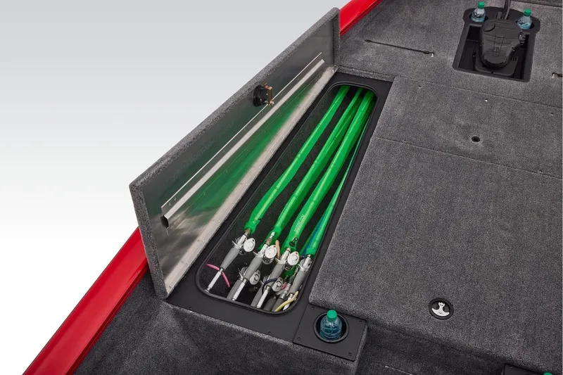 Slide: The Image of 2026 Tracker Pro Team 190 boat with open storage compartment and green fishing rods. - 16