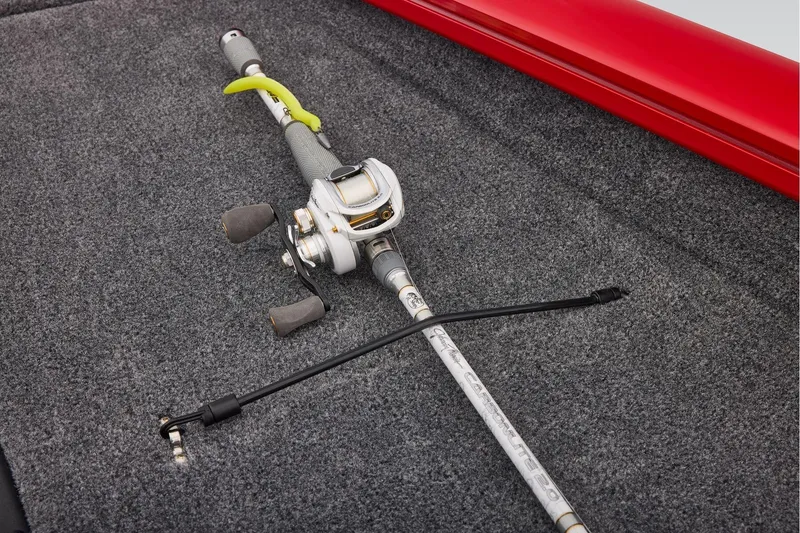 Slide: The Image of Fishing rod and reel on Tracker Pro Team 190 boat carpet, 2026 model. - 21