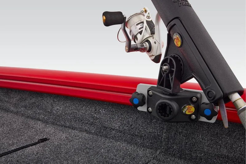 Slide: The Image of Fishing rod holder on 2026 Tracker Pro Team 190 boat with red trim and carpeted interior. - 22