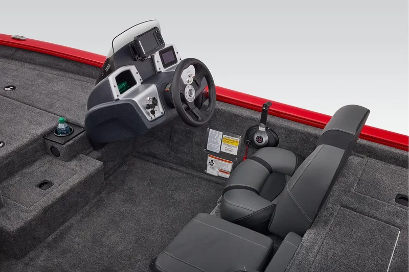 Slide: The Image of 2026 Tracker Pro Team 190 boat interior with steering console and seating. - 25