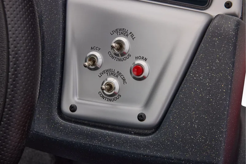 Slide: The Image of Control panel of 2026 Tracker Pro Team 190 boat with switches and horn button. - 31